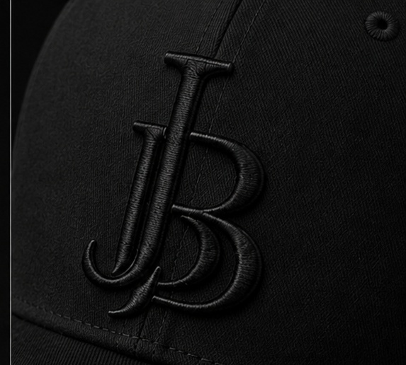 Close-up of the tonal black JB monogram 3D puff embroidery on the cap